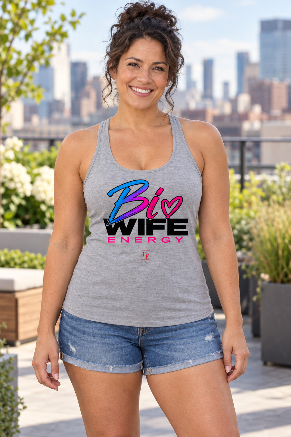 Bi Wife Energy Racerback Tank in Heather Grey, woman wearing the tank in a lifestyle setting
