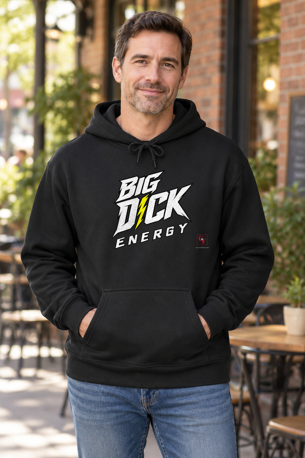 Big Dick Energy Hoodie in Black on a model outdoors — Common Flavor