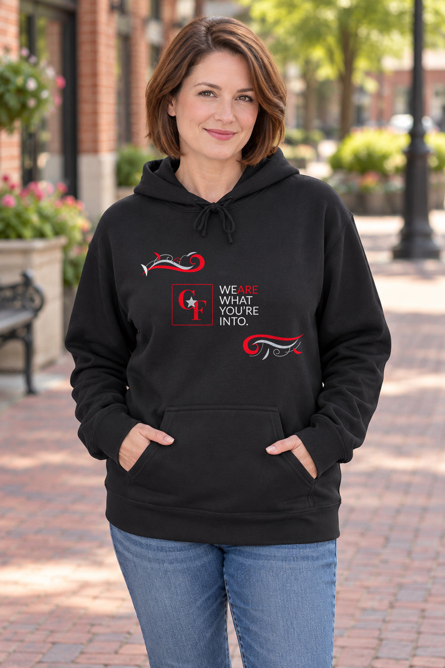 CF Originals "We Are What You're Into" Flowing Twist Hoodie in Black on a model outdoors — Common Flavor