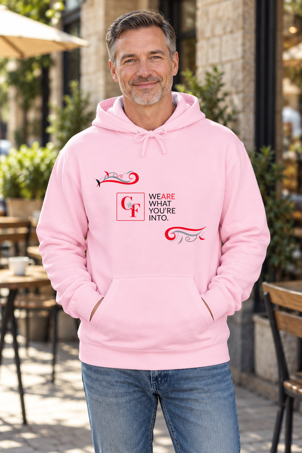 CF Originals "We Are What You're Into" Flowing Twist Hoodie in Light Pink on a model outdoors — Common Flavor
