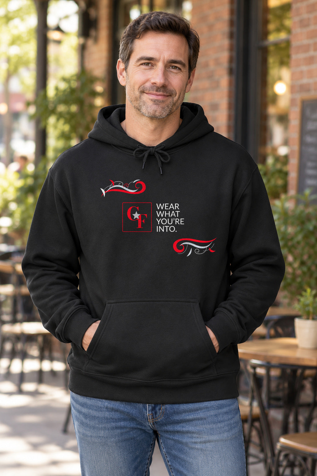 CF Originals "Wear What You're Into" Flowing Twist Hoodie in Black on a model outdoors — Common Flavor