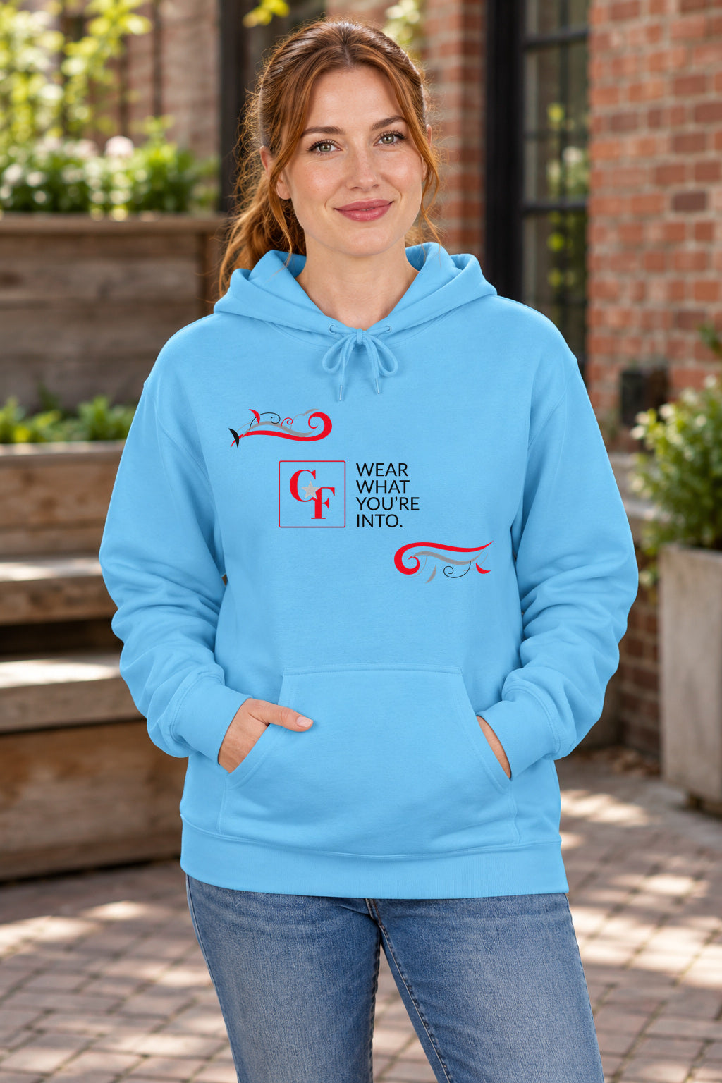 CF Originals "Wear What You're Into" Flowing Twist Hoodie in Sky on a model outdoors — Common Flavor