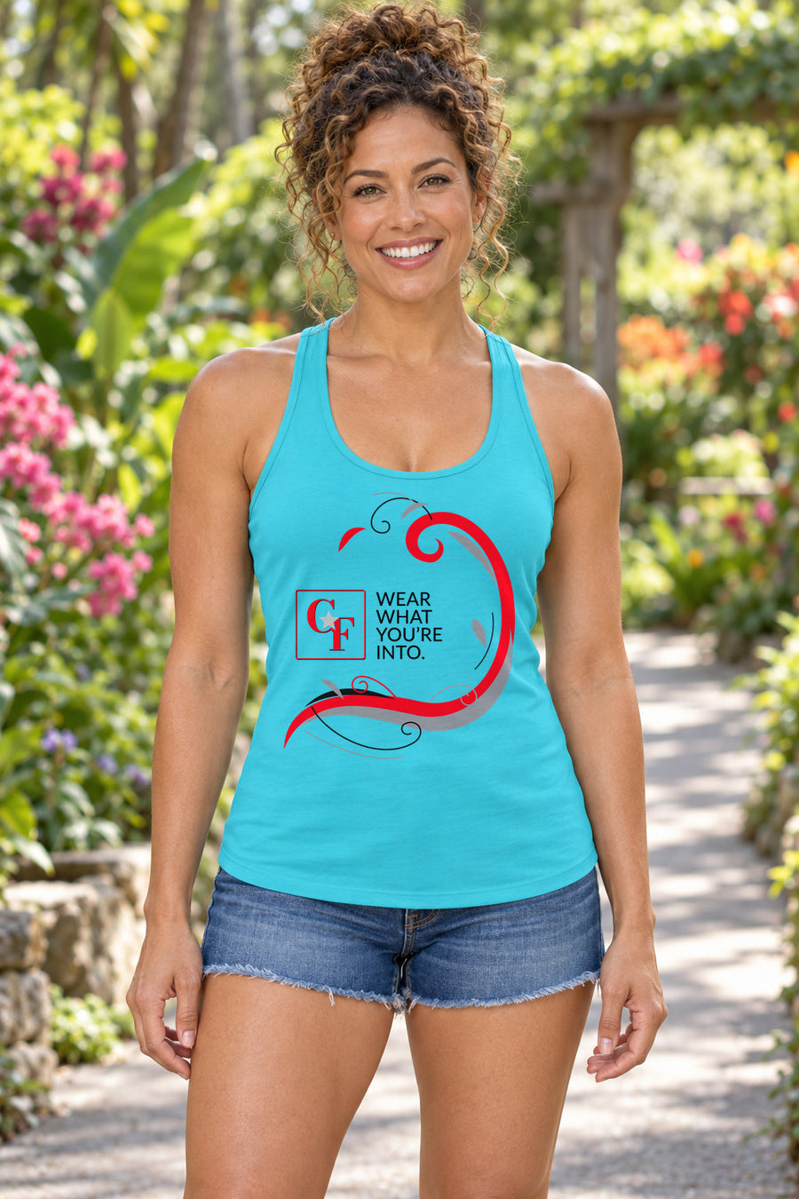 Common Flavor Originals "Wear What You're Into" Side Sweep Racerback Tank in Tahiti Blue, woman wearing the tank in a lifestyle setting