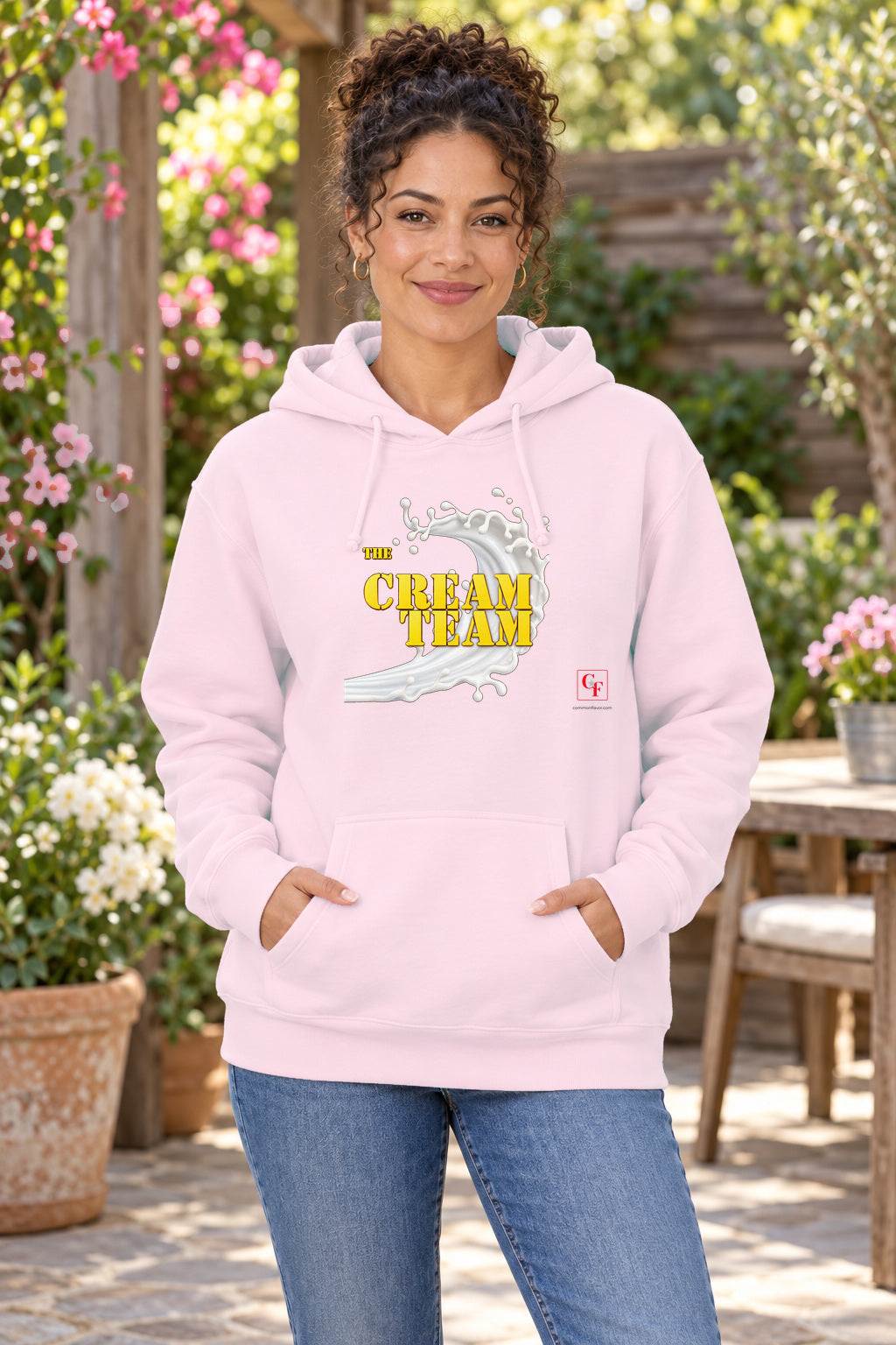 Cream Team Original Refresh Hoodie in Light Pink on a model outdoors — Common Flavor
