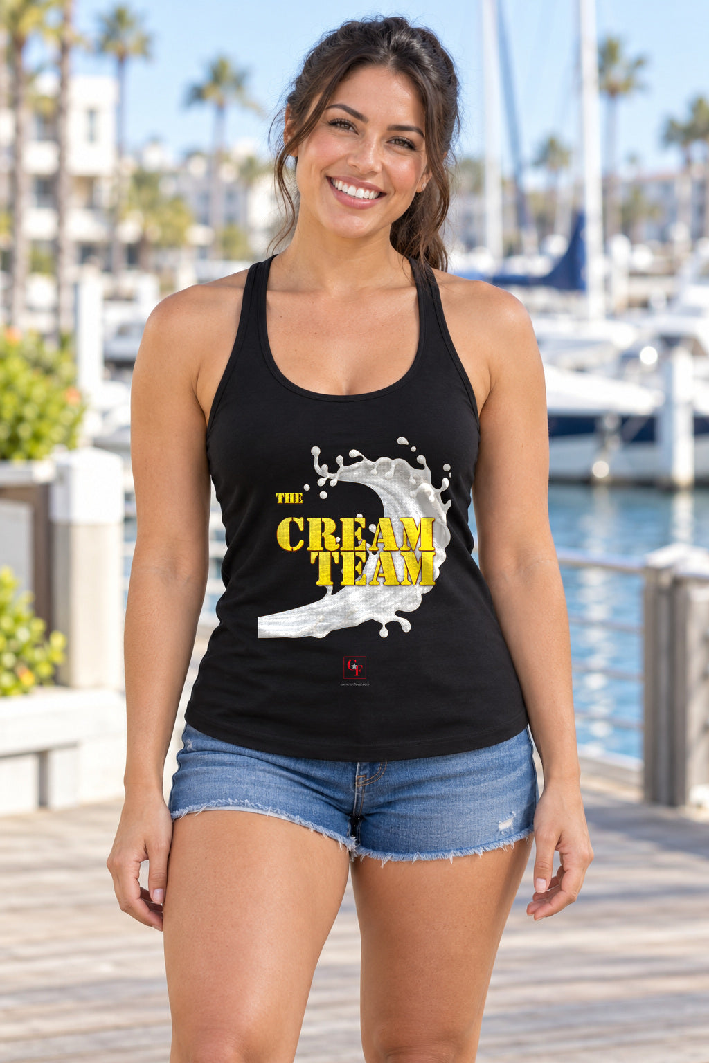 Cream Team Original Refresh Racerback Tank in Black, woman wearing the tank in a lifestyle setting