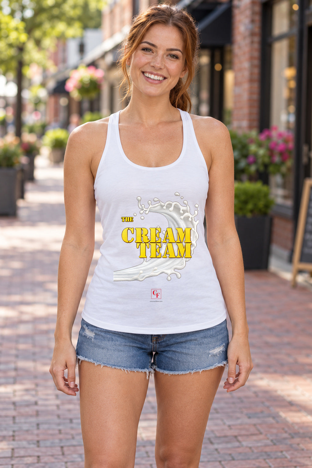 Cream Team Original Refresh Racerback Tank in White, woman wearing the tank in a lifestyle setting