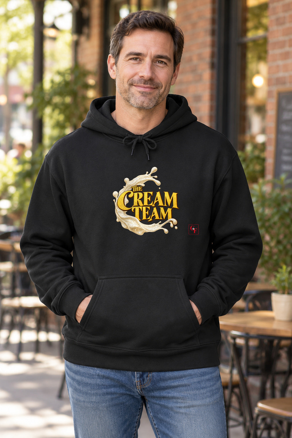 Cream Team Splash Hoodie in Black on a model outdoors — Common Flavor