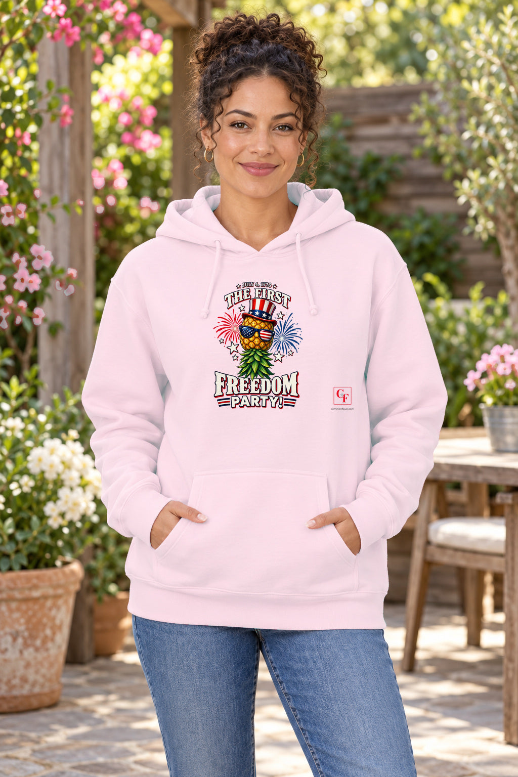 First Freedom Party Hoodie in Light Pink on a model outdoors — Common Flavor