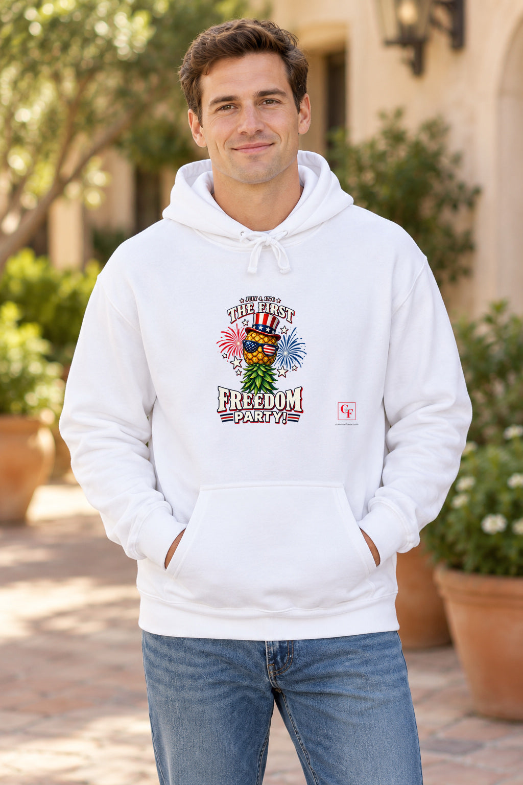 First Freedom Party Hoodie in White on a model outdoors — Common Flavor