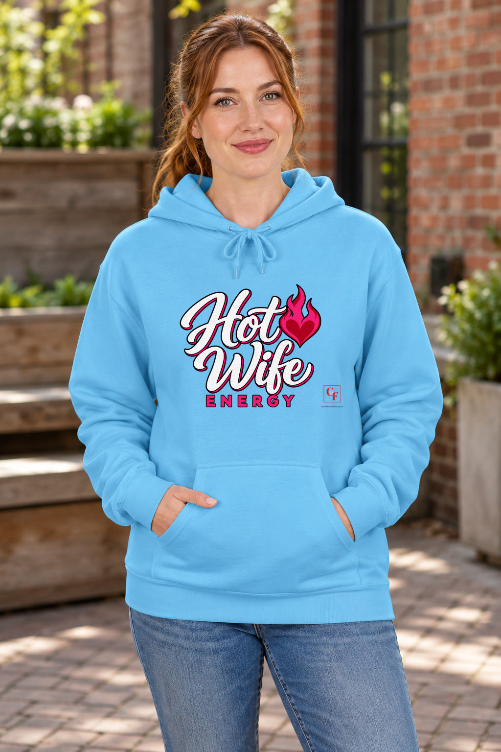 Hot Wife Energy Hoodie in Sky on a model outdoors — Common Flavor