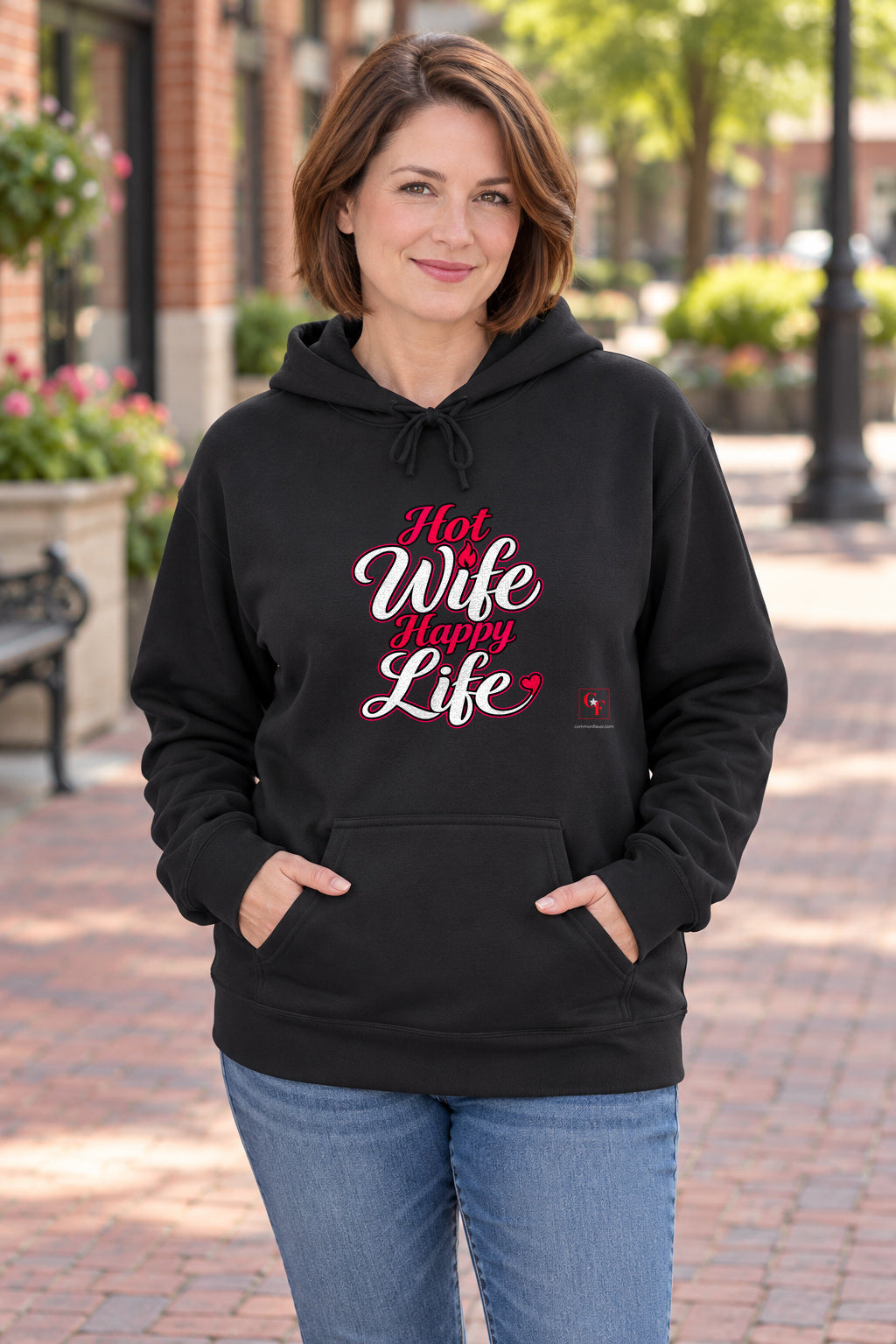 Hot Wife Happy Life Hoodie in Black on a model outdoors — Common Flavor