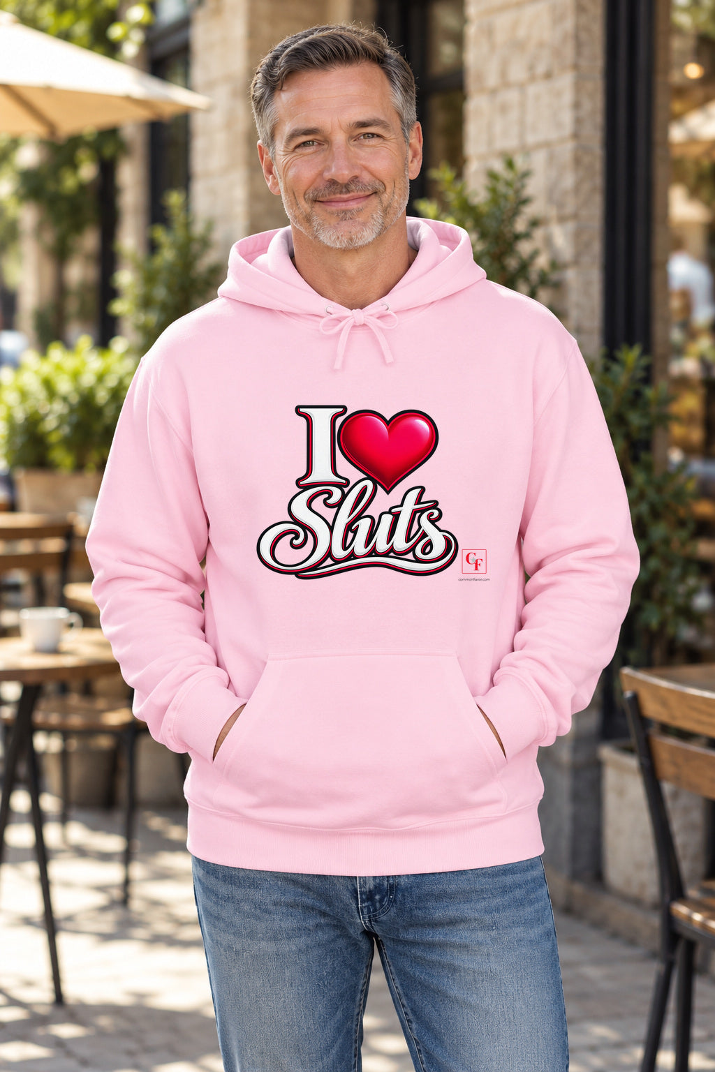 I Heart Sluts Hoodie in Light Pink on a model outdoors — Common Flavor
