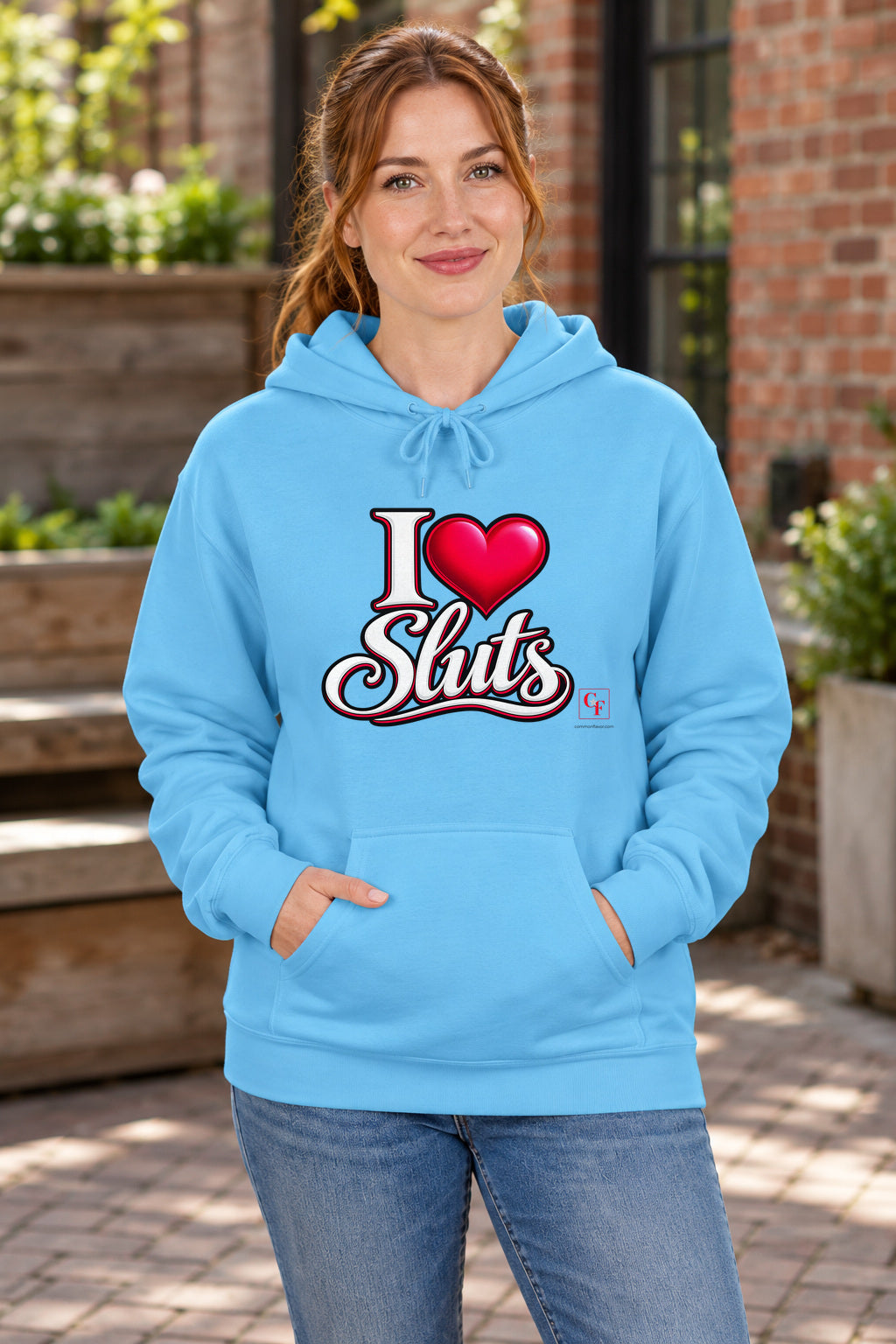 I Heart Sluts Hoodie in Sky on a model outdoors — Common Flavor