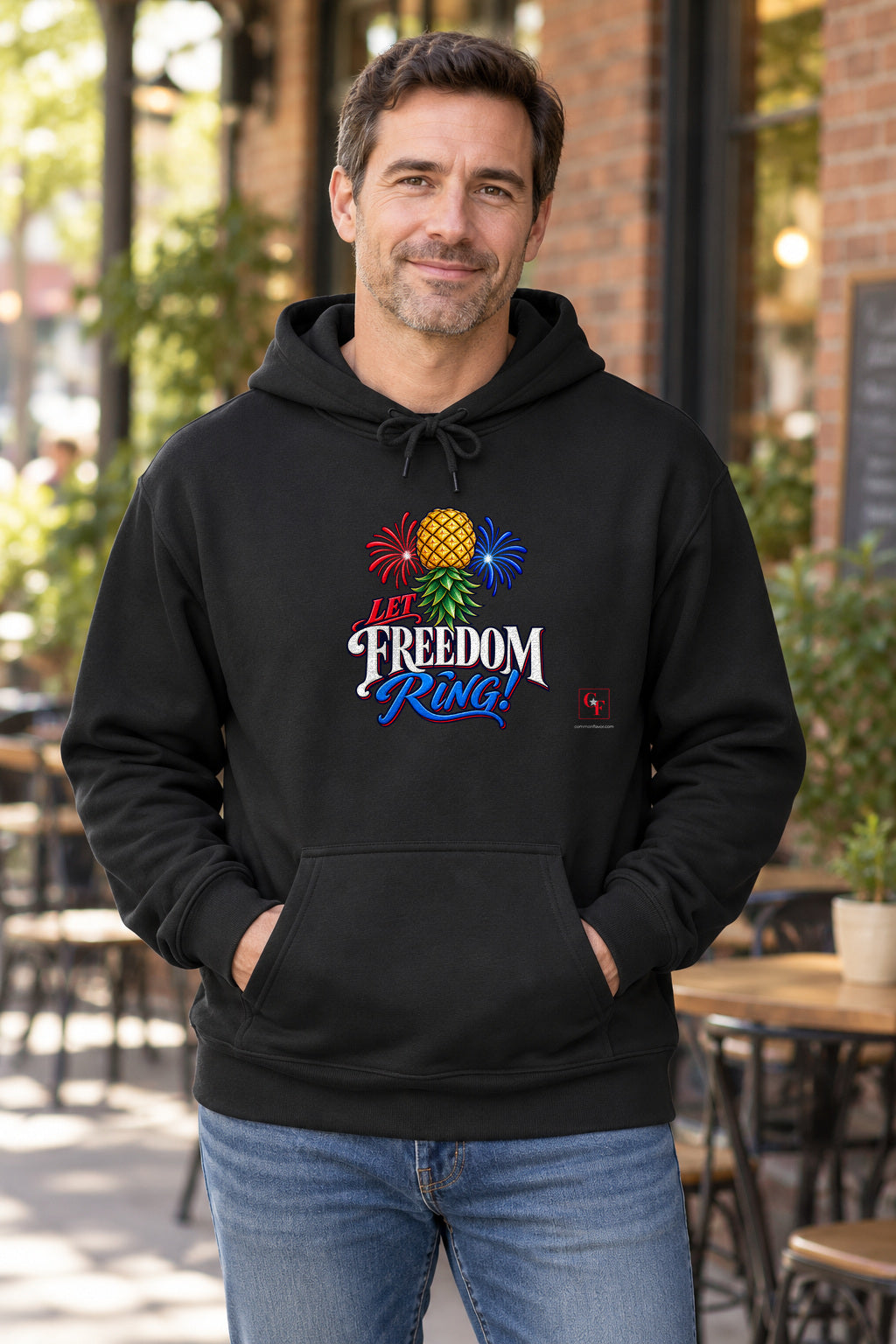 Let Freedom Ring Hoodie in Black on a model outdoors — Common Flavor