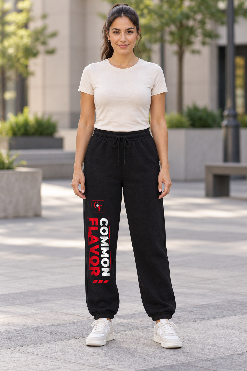 Model wearing Black Common Flavor Sport Track sweatpants outdoors