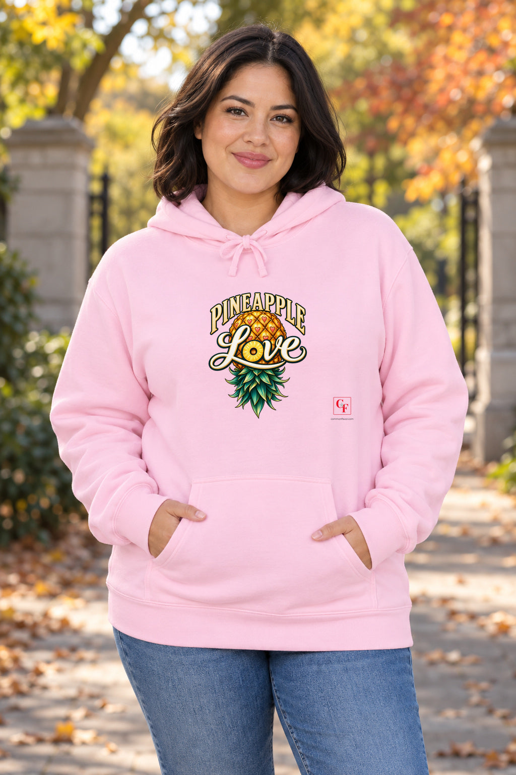 Pineapple Love Hoodie in Light Pink on a model outdoors — Common Flavor