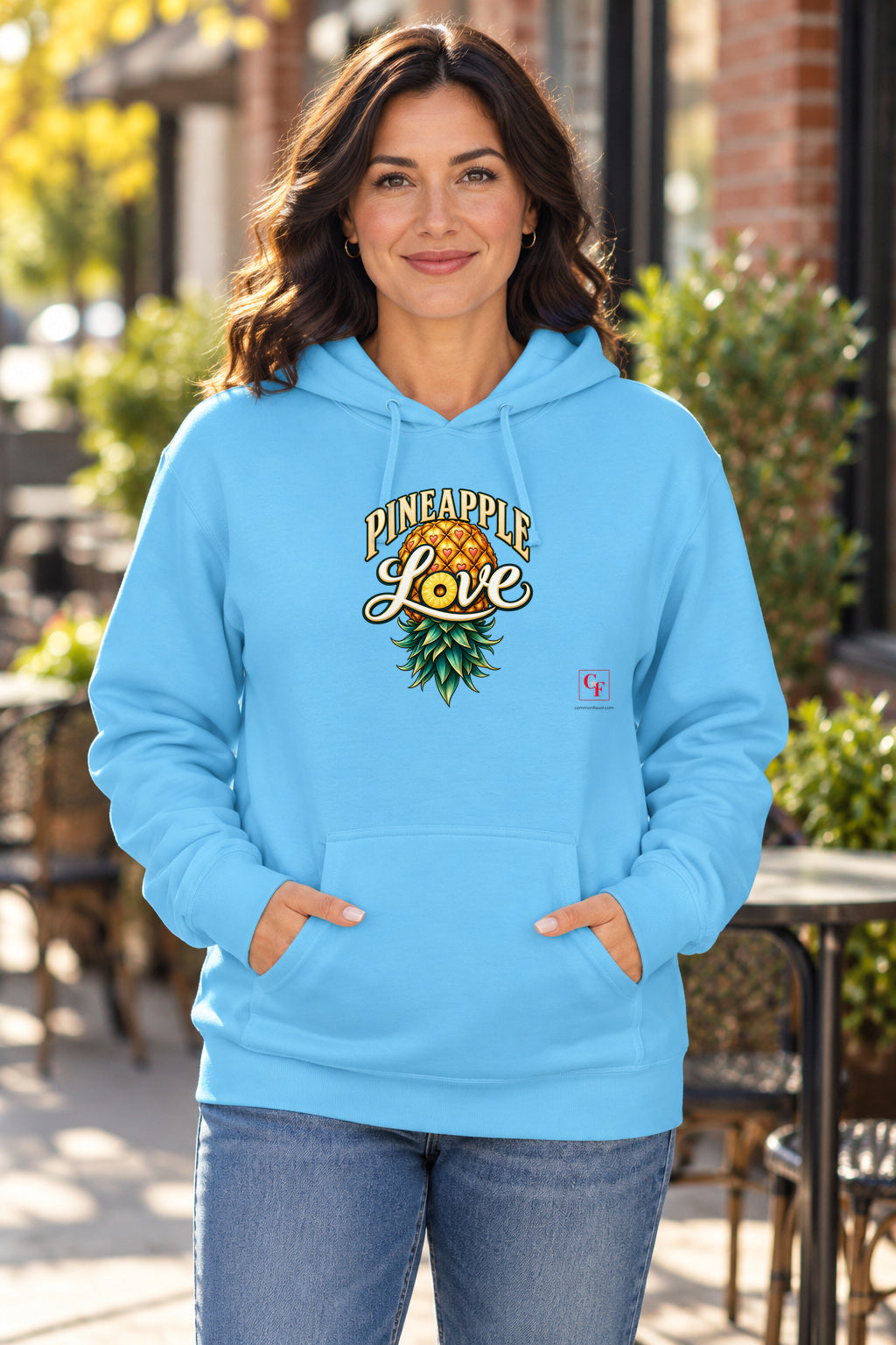 Pineapple Love Hoodie in Sky on a model outdoors — Common Flavor