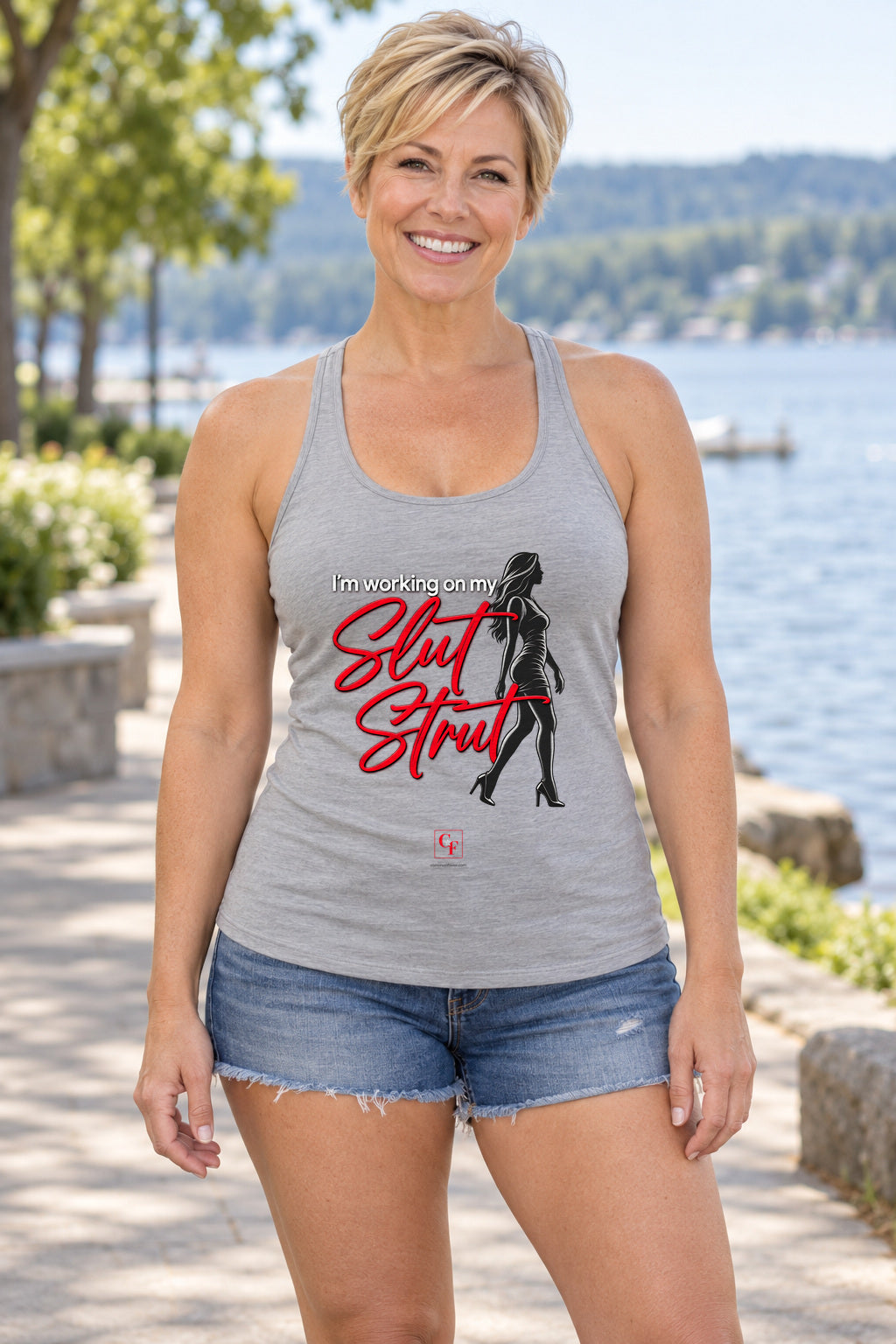 Slut Strut Racerback Tank in Heather Grey, woman wearing the tank in a lifestyle setting
