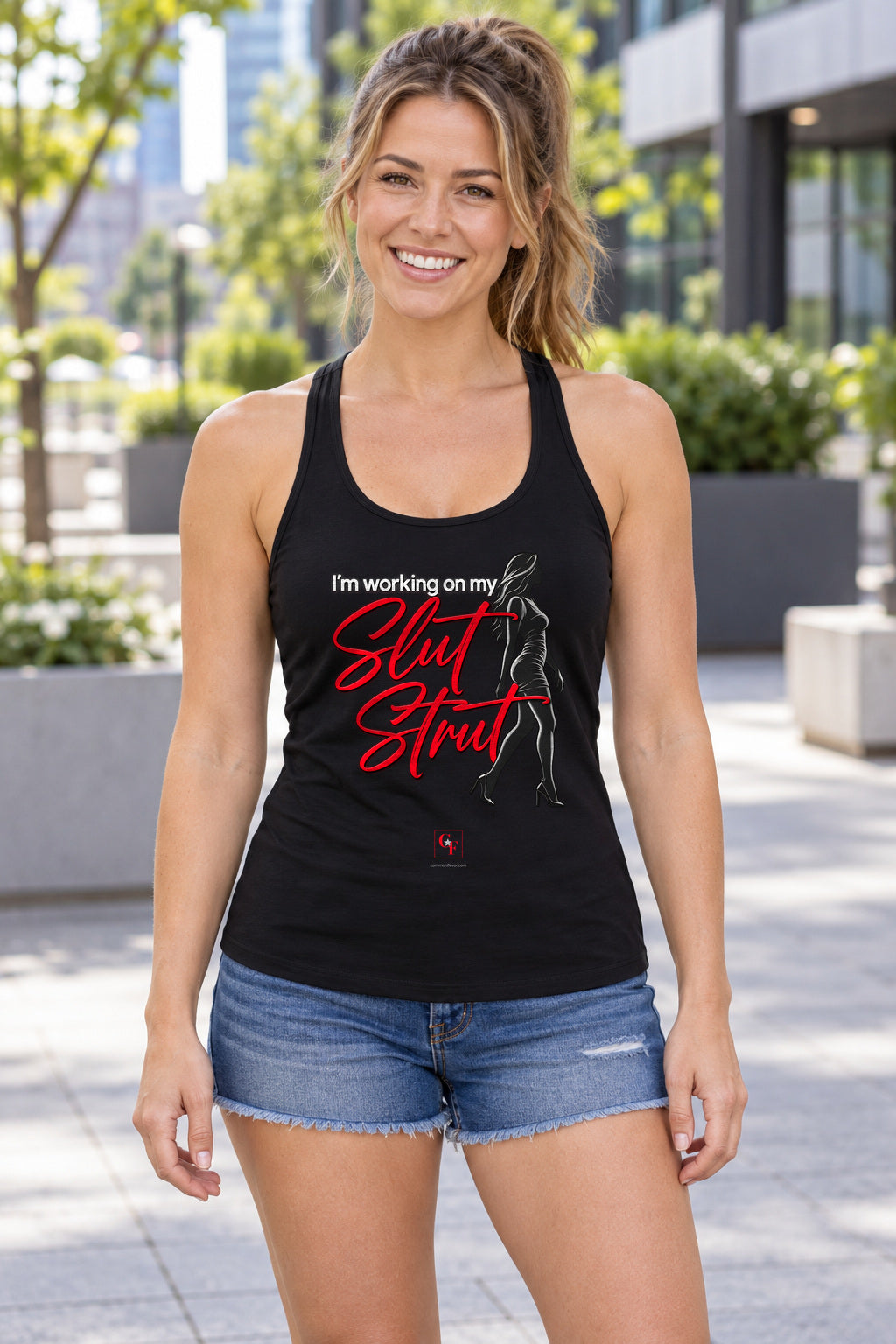 Slut Strut Racerback Tank in Black, woman wearing the tank in a lifestyle setting