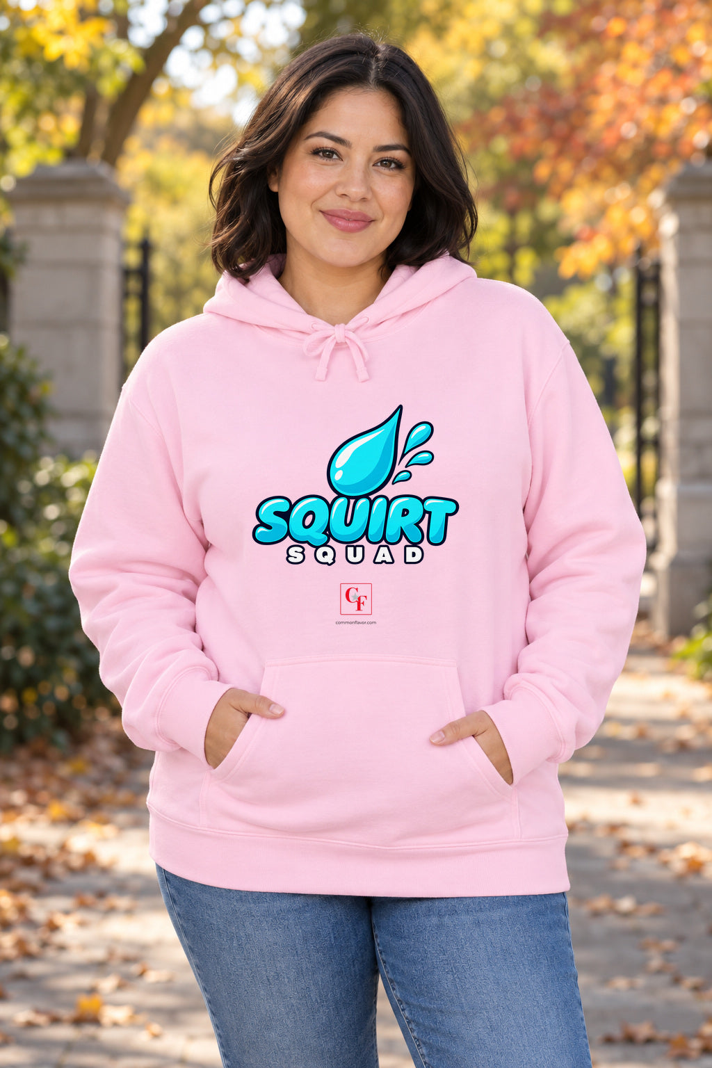 Squirt Squad Variation Hoodie in Light Pink on a model outdoors — Common Flavor