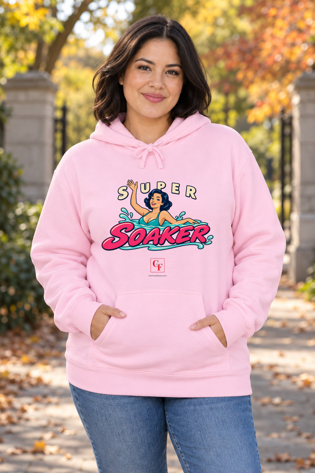 Super Soaker Female Variation Hoodie in Light Pink on a model outdoors — Common Flavor