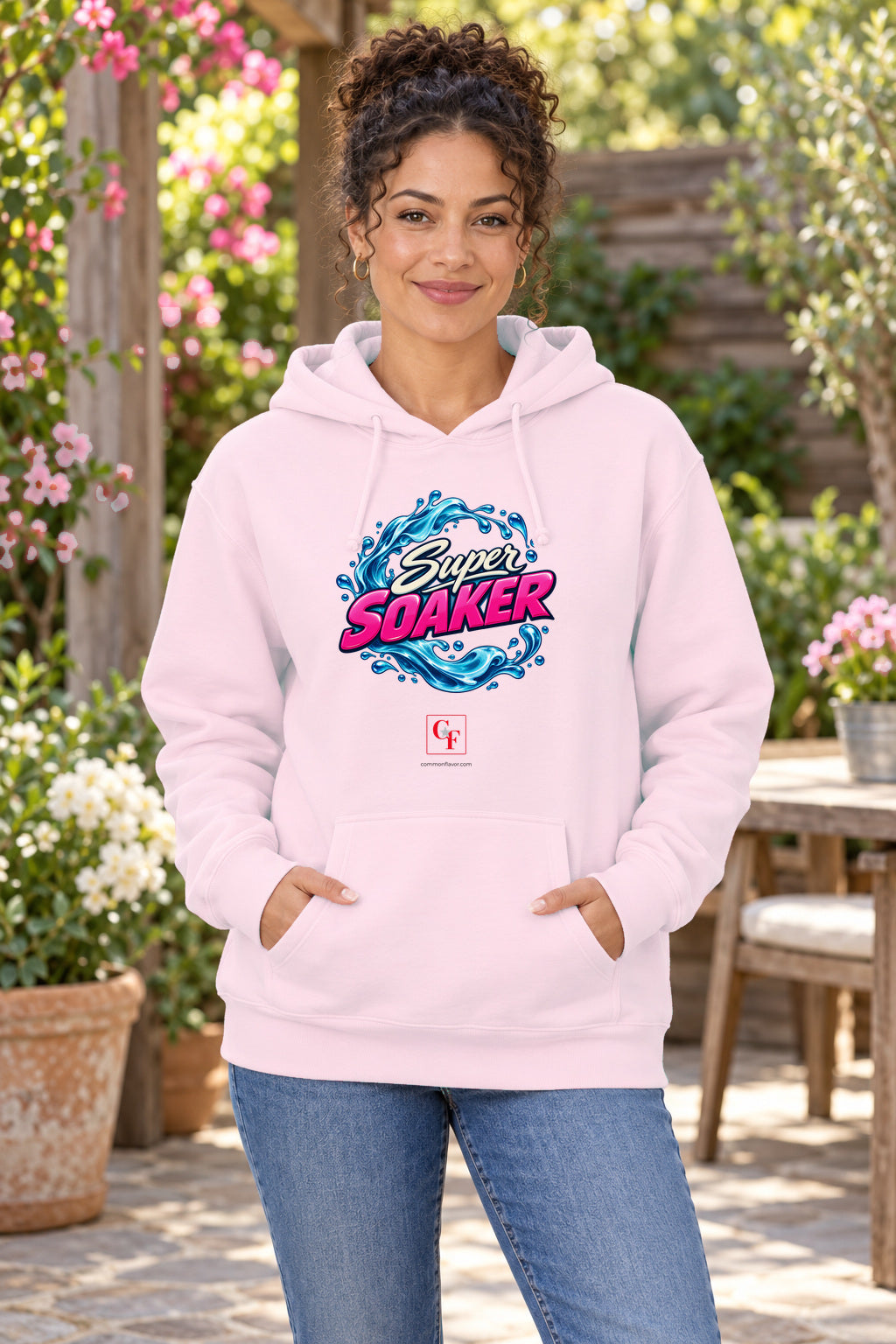 Super Soaker Hoodie in Light Pink on a model outdoors — Common Flavor
