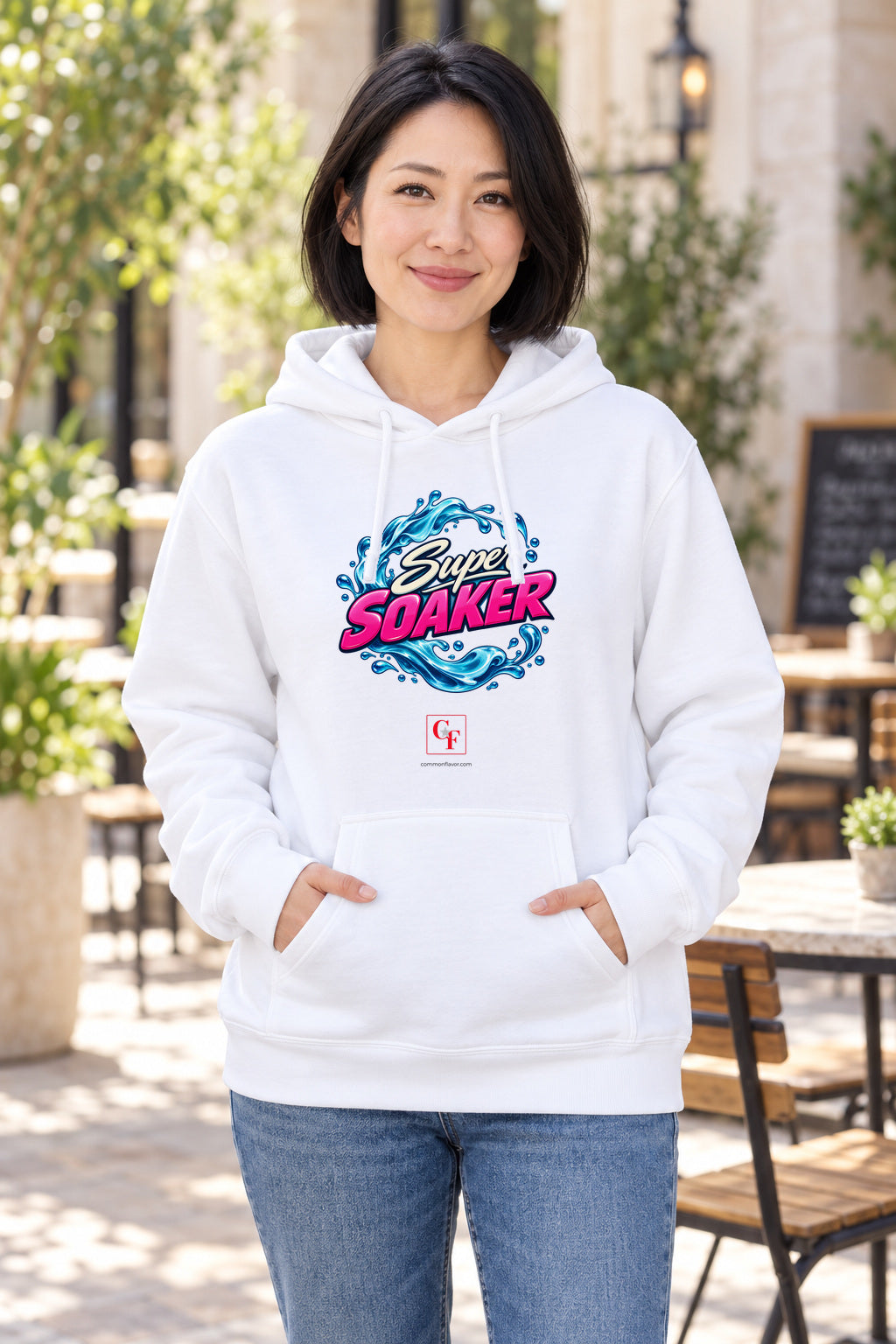 Super Soaker Hoodie in White on a model outdoors — Common Flavor