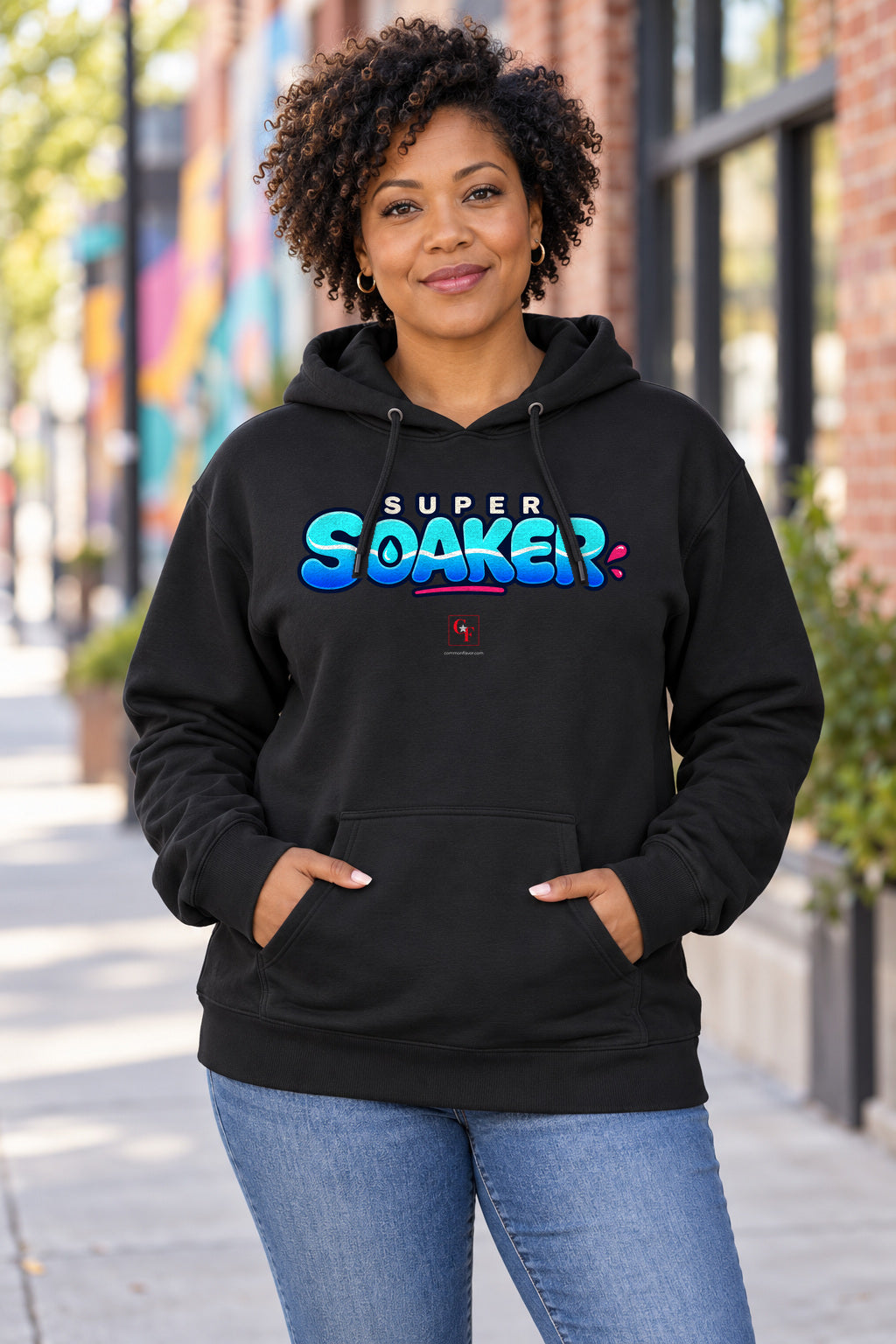 Super Soaker Variation Hoodie in Black on a model outdoors — Common Flavor