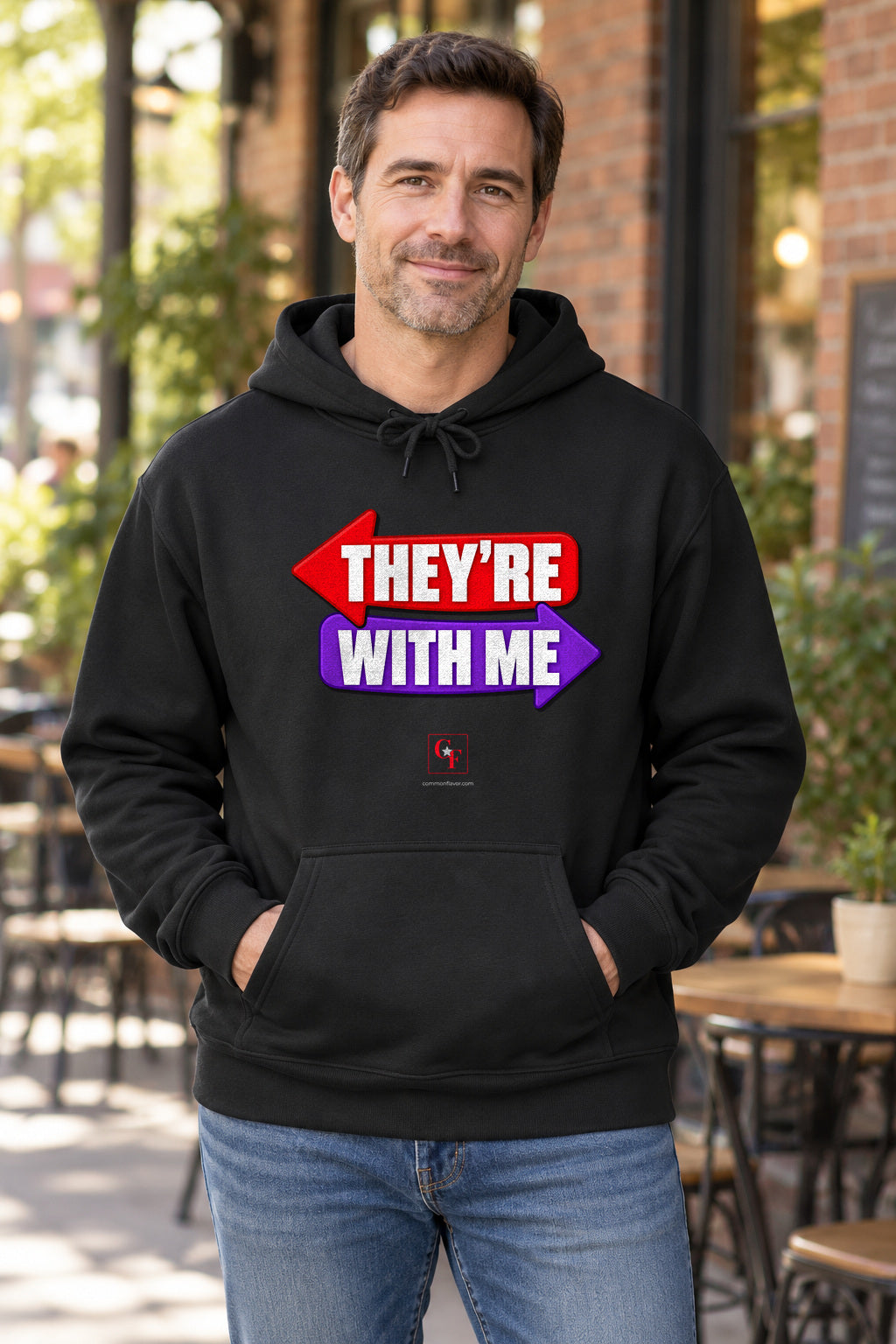 They're With Me Hoodie in Black on a model outdoors — Common Flavor