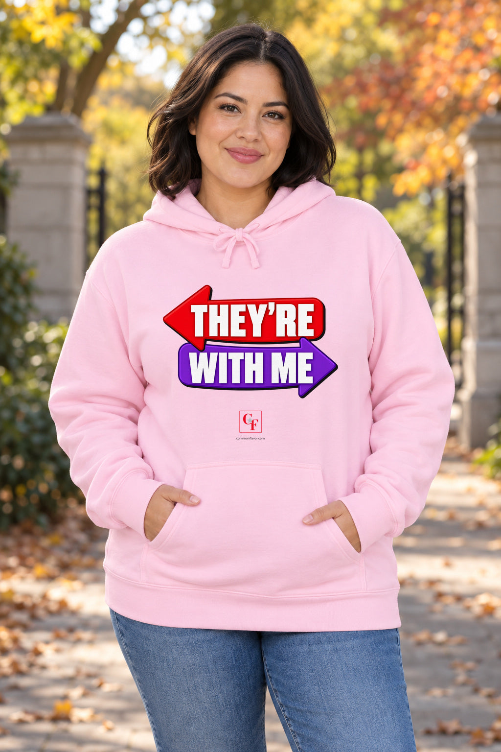 They're With Me Hoodie in Light Pink on a model outdoors — Common Flavor