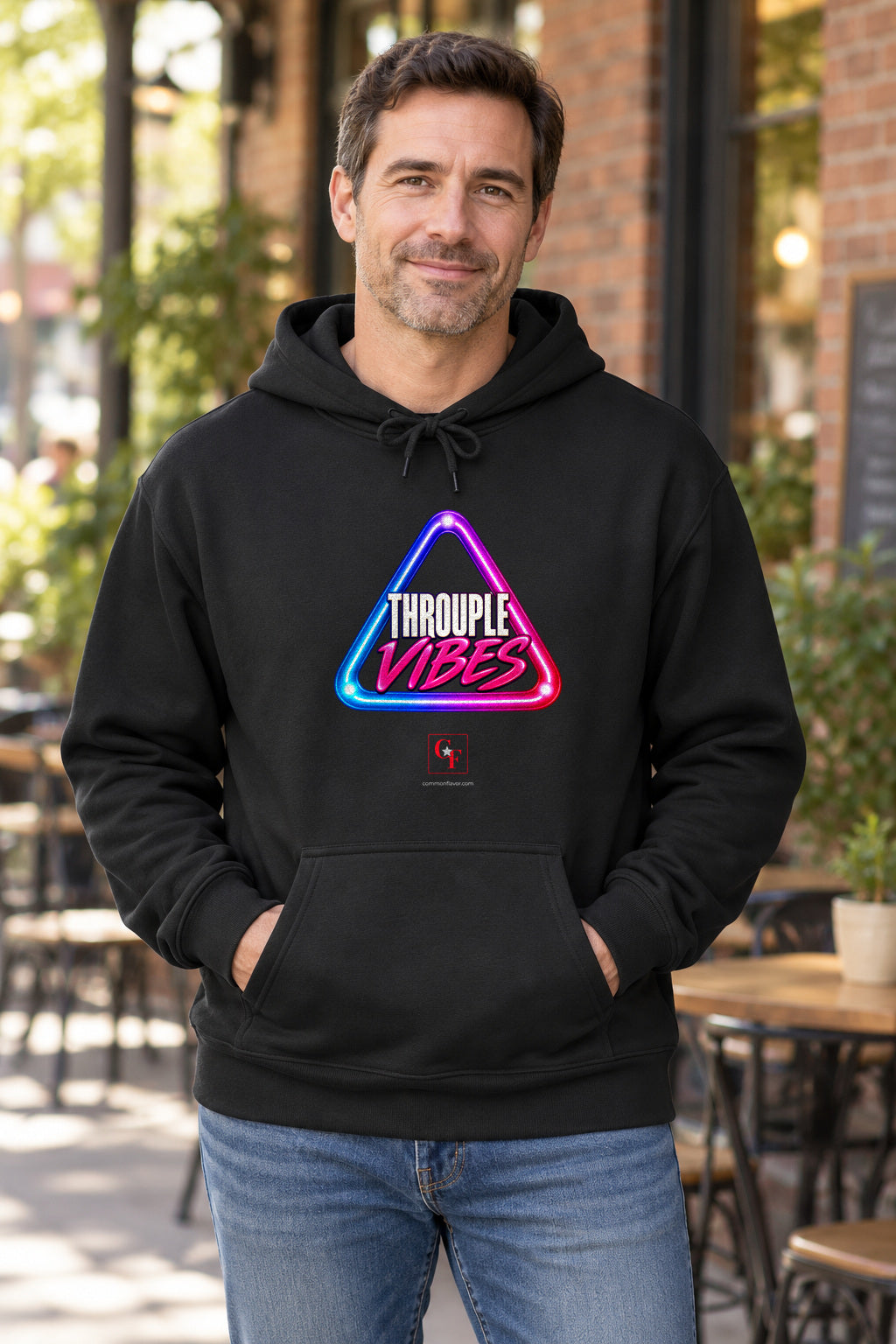 Throuple Vibes Hoodie in Black on a model outdoors — Common Flavor