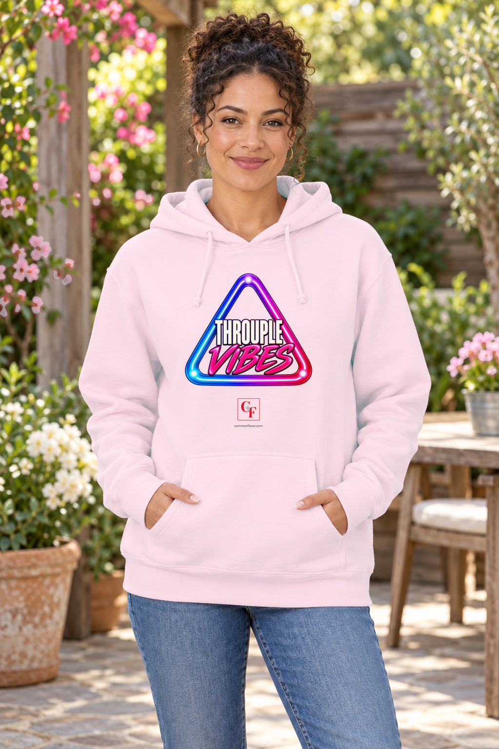Throuple Vibes Hoodie in Light Pink on a model outdoors — Common Flavor