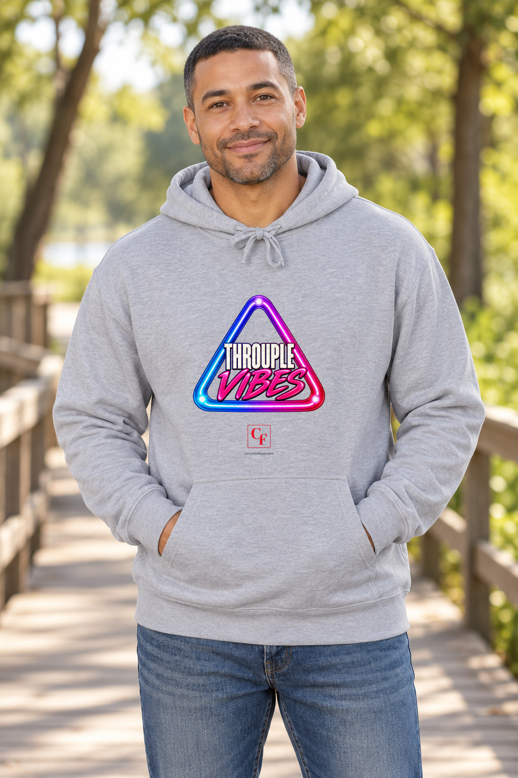Throuple Vibes Hoodie in Sport Grey on a model outdoors — Common Flavor